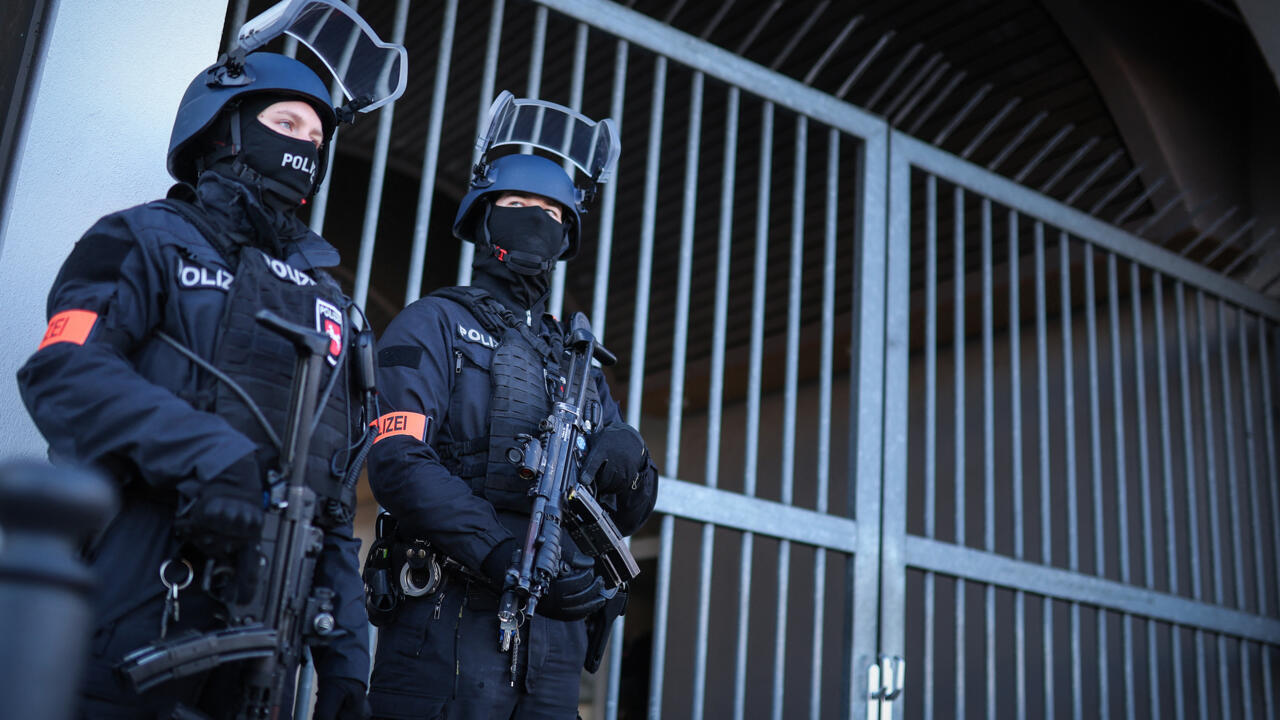 Armed police stand guard on April 1, 2025 at the compound of the court building in Celle, northern Germany, prior the start of the trial of Daniela Klette, 66, a former member of German far-left milit