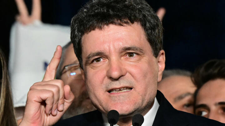 Romanian presidential candidate Nicusor Dan speaks to supporters after exit poll results were announced in Bucharest, on May 18, 2025.