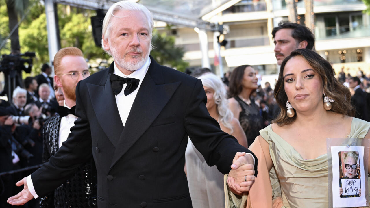 Julian Assange and his wife Swedish-Spanish lawyer Stella Assange arrive for the screening of the film "The Six Billion Dollar Man" at the 78th edition of the Cannes Film Festival in Cannes on May 21, 2025.