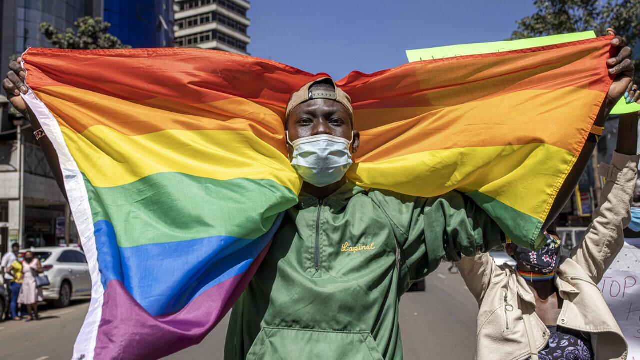 A man holds a rainbow flag during a protest organised by The Queer Republic advocacy group in Nairobi on January 13, 2022.
