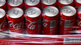 This photograph taken on November 3, 2022 shows packs of Coca-Cola bottles on a supermarket shelf in Septemes-les-Vallons near Marseille.