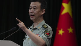 A file photo of Chinese Defense Ministry spokesperson Wu Qian speaking during a press conference in Beijing, Thursday, May 30, 2024