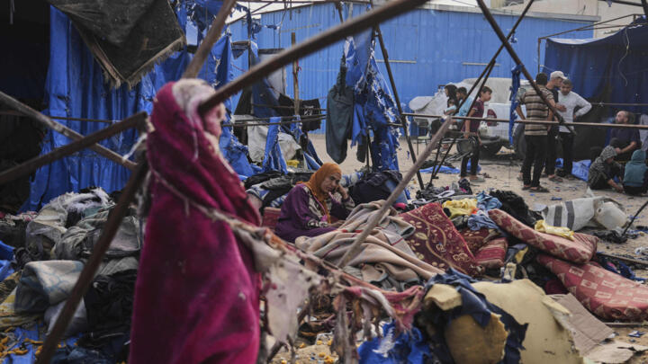 Palestinians inspect the damage caused by an Israeli airstrike that struck tents at Al-Aqsa Hospital in Deir al-Balah, central Gaza Strip, May 17, 2025.