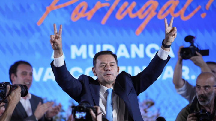 Incumbent Prime Minister and leader of the center-right Social Democratic Party Luis Montenegro gestures addresses supporters, in Lisbon on May 19, 2025.