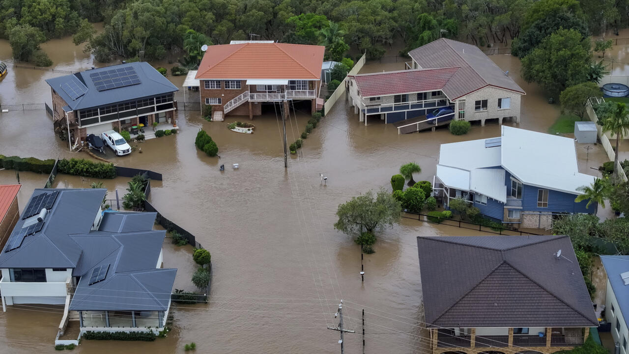 Flood waters surround houses in Port Macquarie, north of Sydney, Australia, Thursday, May 22, 2025.