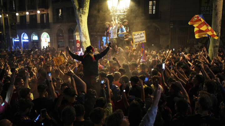 FC Barcelona fans celebrate their club's 28th La Liga title.