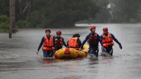 A rescue team bringing a local resident to safety in Australia's New South Wales on March 21, 2021.