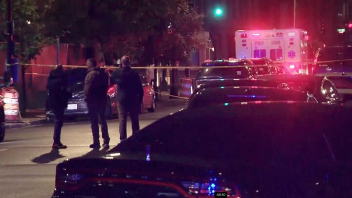 Emergency vehicles line a street where two Israeli embassy staff were shot dead in Washington, DC, May 21, 2025.